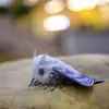 Artistic butterfly figurine with fall motifs