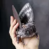 Brown moth figurine with fluffy body
