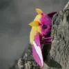 a lifelike Rosy maple moth doll