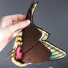 Back view of Spanish Moon Moth plush doll — layered wing design and soft faux fur details